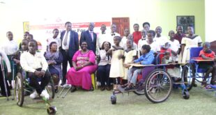 minister Hellen Asamo with children with spina bifida and hydrocephaus and SHAU 1536x1024 1