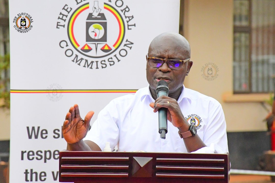 THE CHAIRPERSON OF THE ELECTORAL COMMISSION JUSTICE BYABAKAMA MUGENYI SIMON