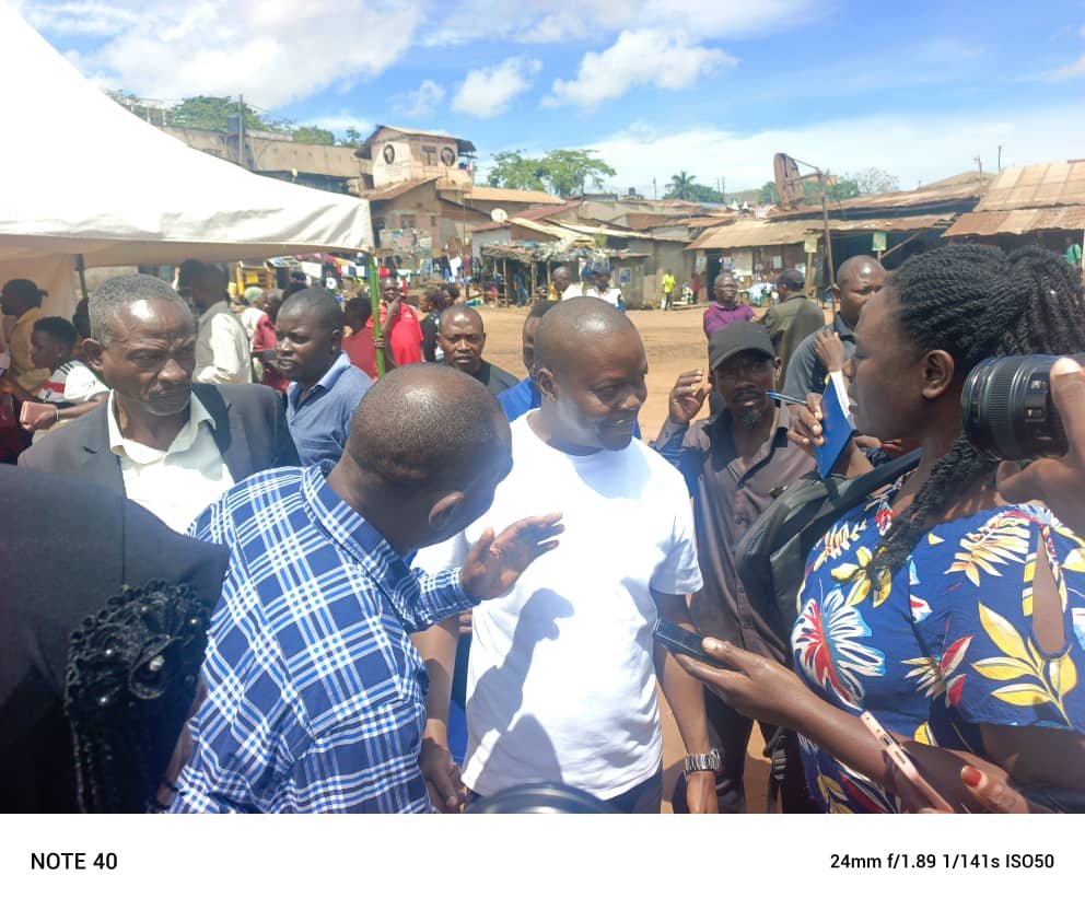 Lukka in white t shart engages with residents